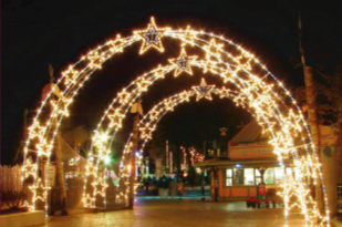 outdoor lighted archway directing to event