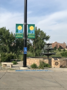 street pole with city's double banner