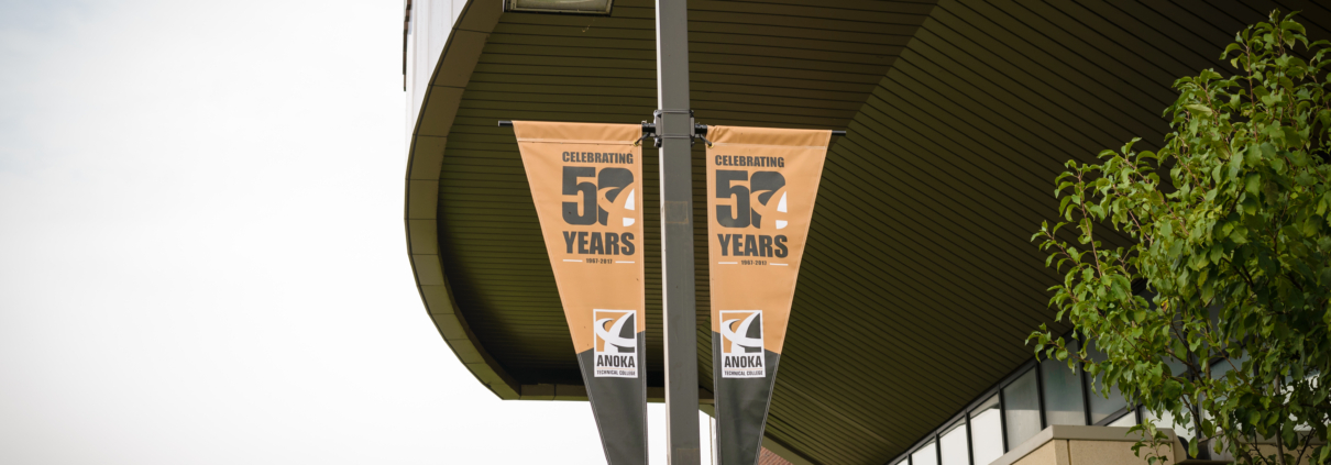 Streetscape Banners - Mainstreet Designs Anoka Technical College pole banner - Anniversary Year