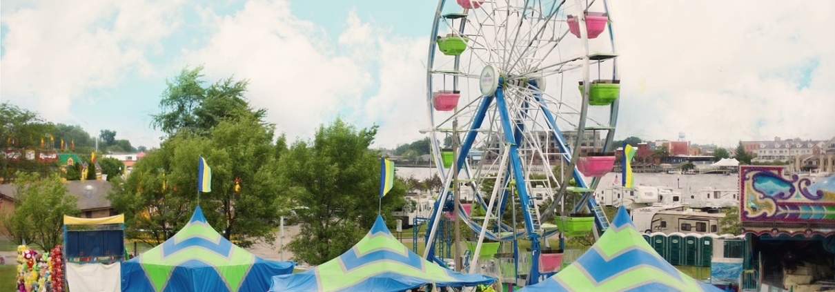 carnival setting with ferris wheel and game venues