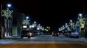 Light Pole Decorations - night time street with banners and pole mount holiday decor