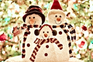 holiday decorations- lighted snowman family with hats and scarves