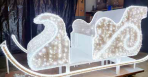 white lighted GARLAND SLEIGH for photos