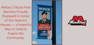 City street lined with patriotic Military Tribute Pole Banners honoring veterans and fallen heroes during Memorial Day.