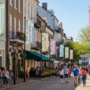 Spring city branding banners in Charleston SC promoting tourism with colorful floral designs and welcoming downtown atmosphere.